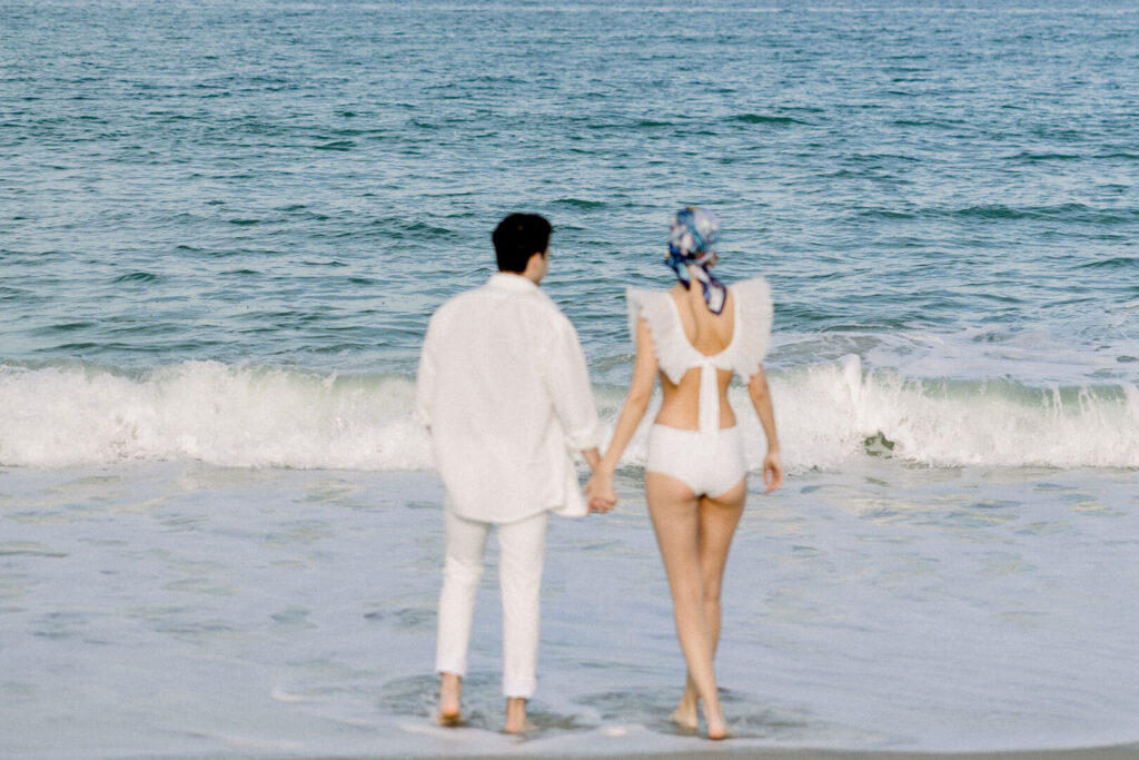 beach engagement session couple holding hand