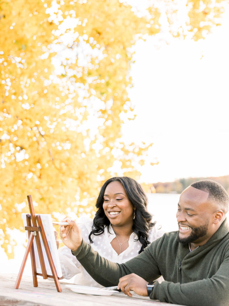 fall engagement session couple painting date at Seven Lakes State Park