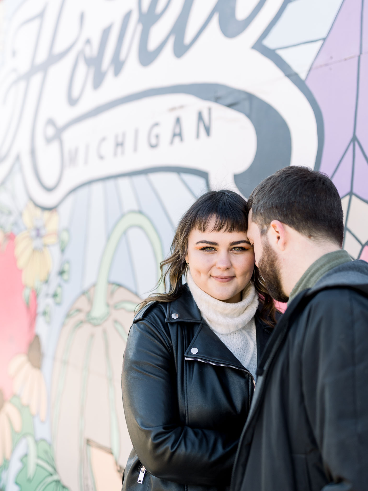 Downtown Howell Engagement Session in front of Mural Wall