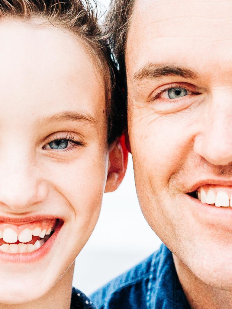 father and son faces close up blue eyes family session