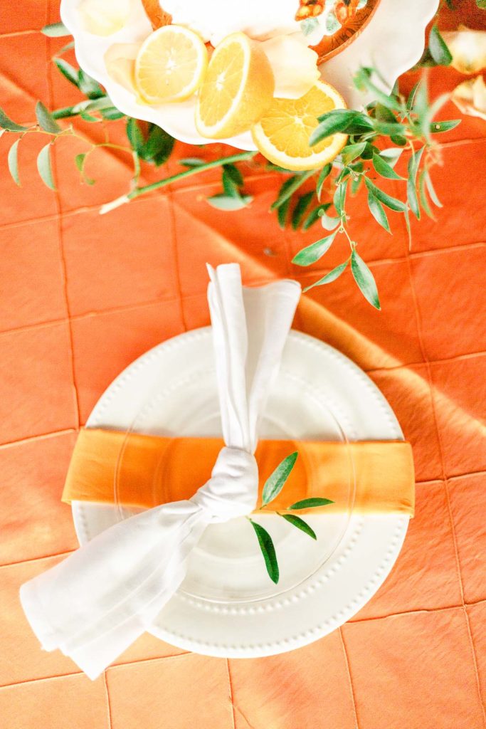 orange citrus wedding tablescape decor and tablecloth