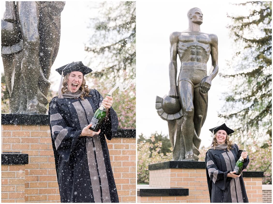 michigan state university graduation photos pop champagne Spartan statue