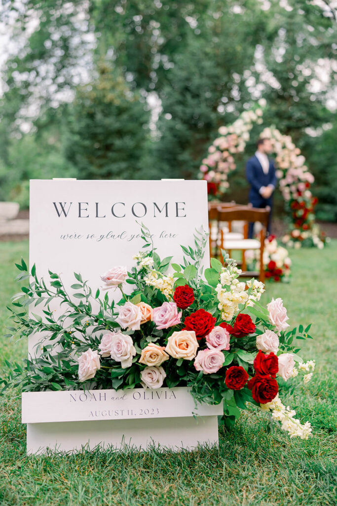 Welcome sign decorated with roses at Venue3Two