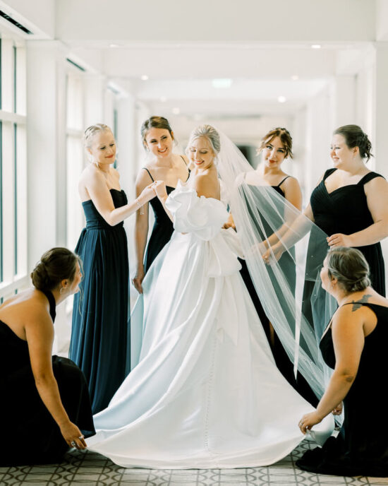 Bride with bridesmaids black and white wedding at the H Hotel in Midland Michigan