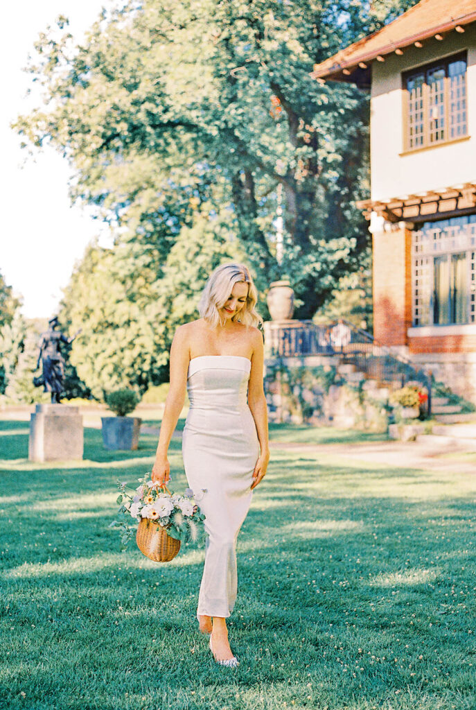 CRANBROOK GARDENS ENGAGEMENT bride in white carrying flower basket