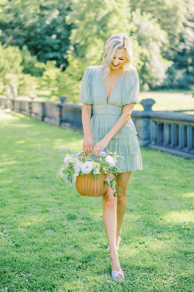 picnic engagement session bride holding a flower basket 