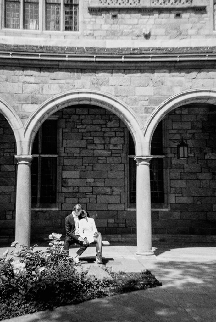 black and white 35mm film engagement photo at Law Quad