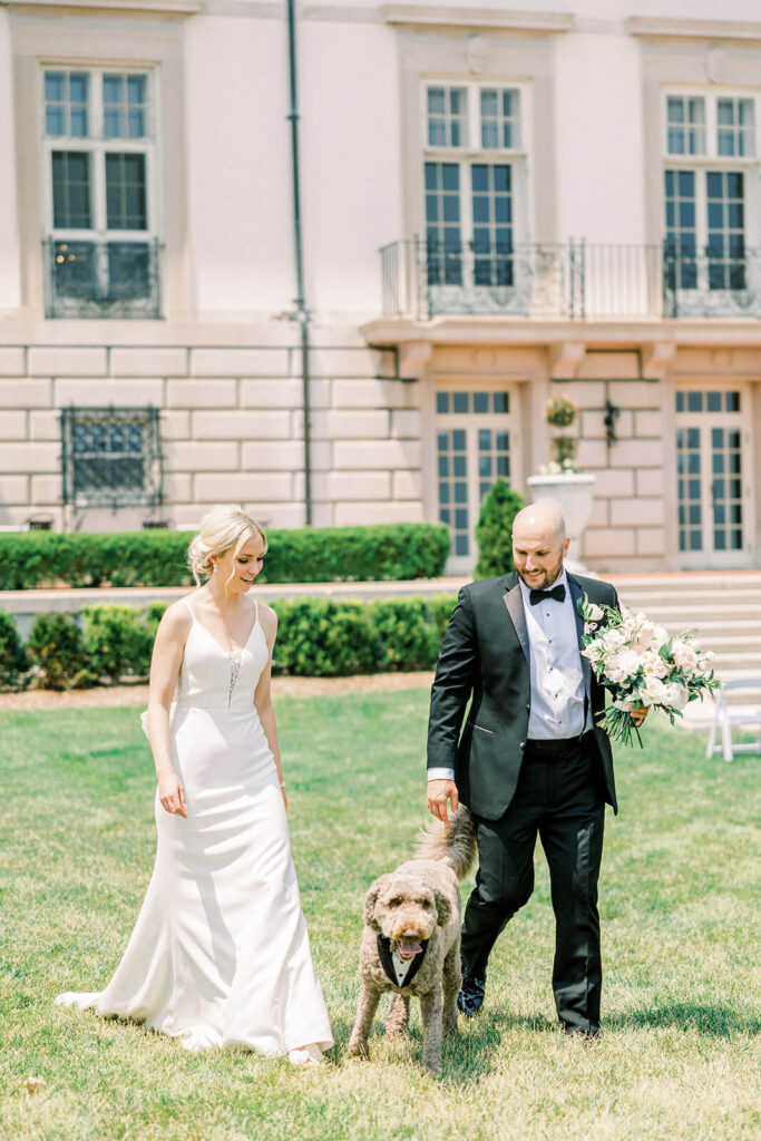 bride and groom with their dog at The Grosse Pointe War Memorial
