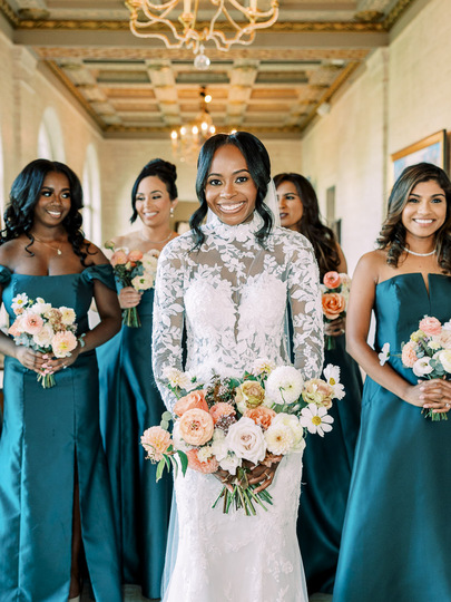 Nigerian wedding bride with bridesmaids in dark green dresses