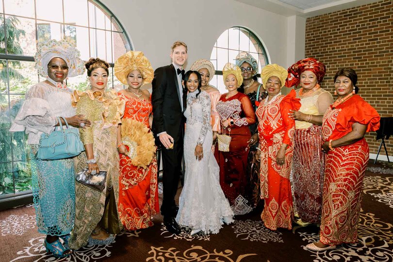 guests in traditional Nigerian wedding attire with bride and groom 