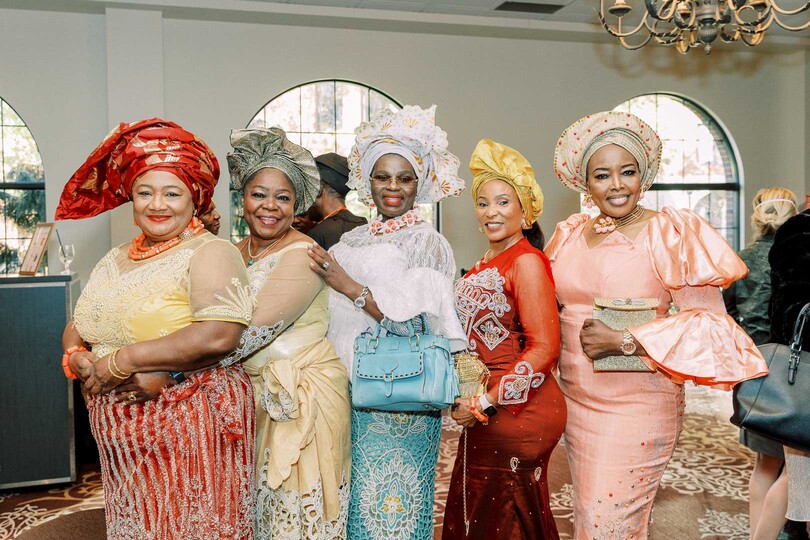 guests in traditional Nigerian wedding attire cocktail hour
