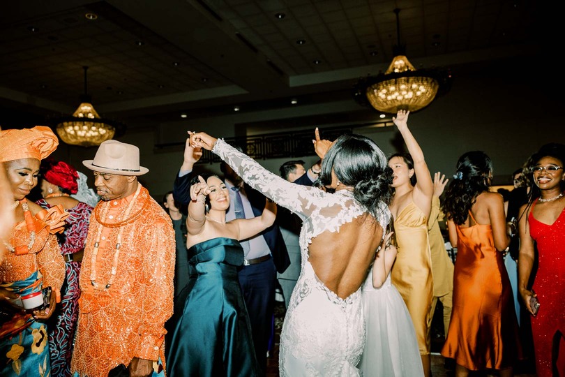 Bride dancing with guests during wedding reception at Saint John's resort