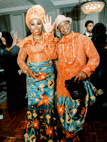 Nigerian parents in traditional attire during wedding reception