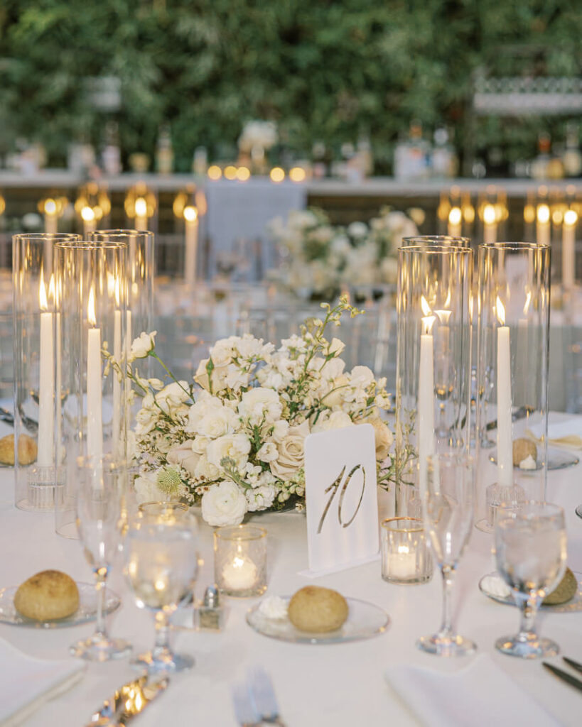 Planterra Conservatory wedding reception candlelit decor with talbe number