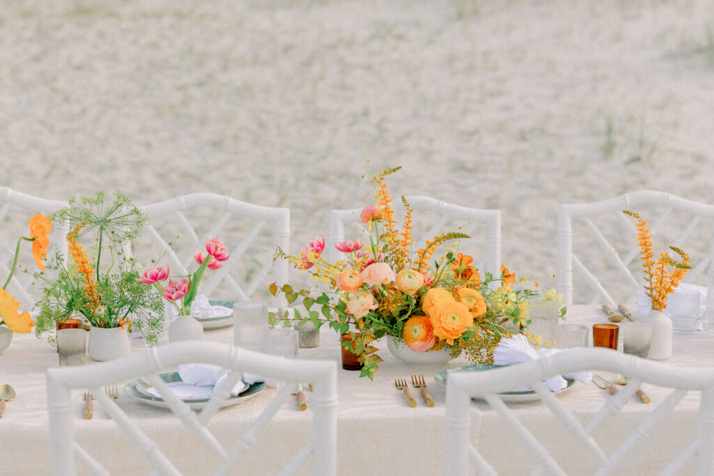 summer floral centerpiece orange and peach beach wedding10