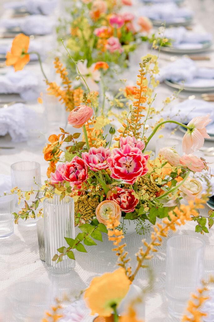 summer floral centerpiece orange and peach beach wedding