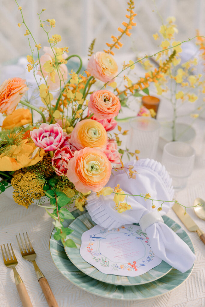 summer floral centerpiece orange and peach beach wedding