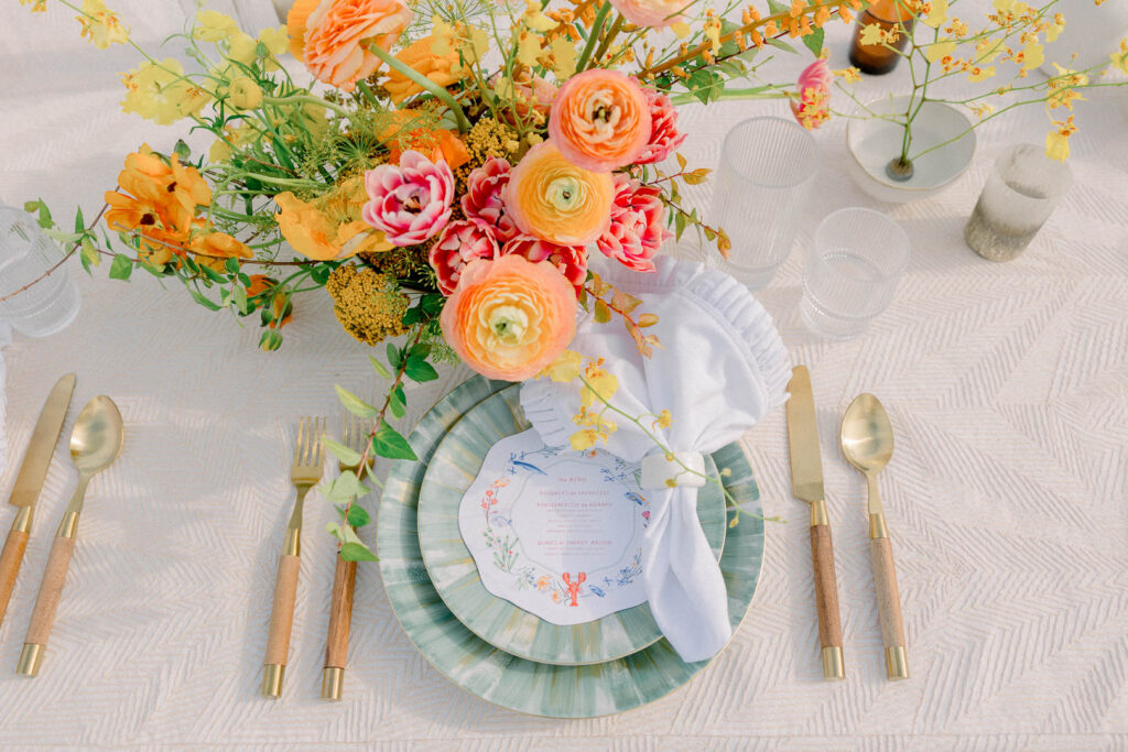 summer floral centerpiece orange and peach beach wedding